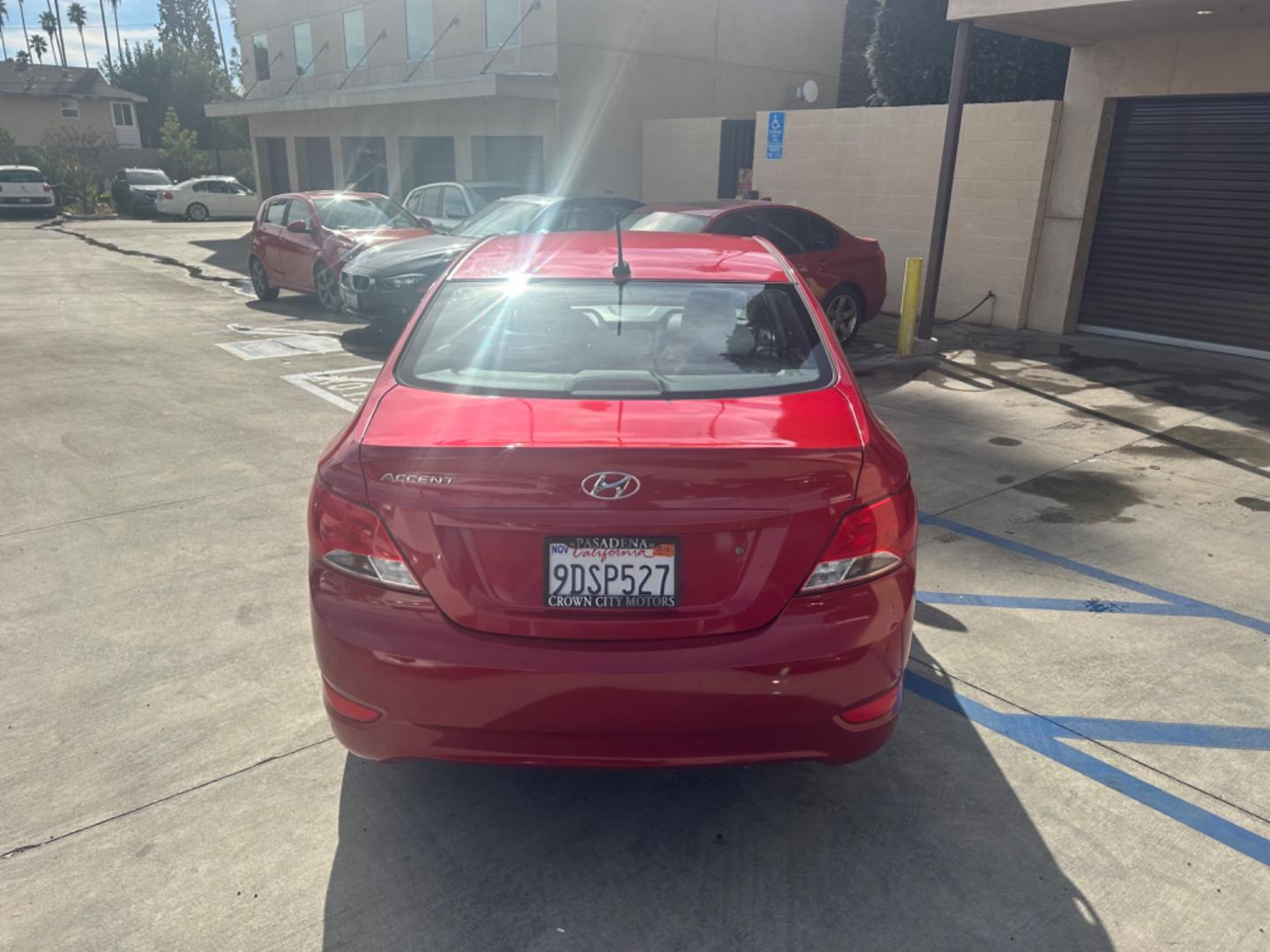 2015 Red /Gray Hyundai Accent GLS Sedan 4D (KMHCT4AE2FU) with an 4-Cyl, 1.6L engine, Auto, 6-Spd w/Overdrive transmission, located at 30 S. Berkeley Avenue, Pasadena, CA, 91107, (626) 248-7567, 34.145447, -118.109398 - The 2015 Hyundai Accent 4-Door Sedan stands as a testament to Hyundai's commitment to quality, efficiency, and value. Located in Pasadena, CA, our dealership specializes in providing a wide range of used BHPH (Buy Here Pay Here) cars, trucks, SUVs, and vans, including the remarkable Hyundai Accent. - Photo#4